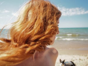 Happy woman smiling at beach