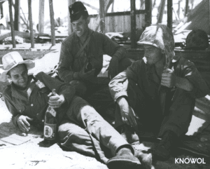 Marines Holding Bottles of Japanese Beer and Wine on Tarawa