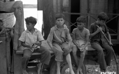 Boys eating sugarcane in a small fishing village of Puerto Real