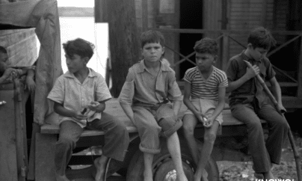 Boys eating sugarcane in a small fishing village of Puerto Real