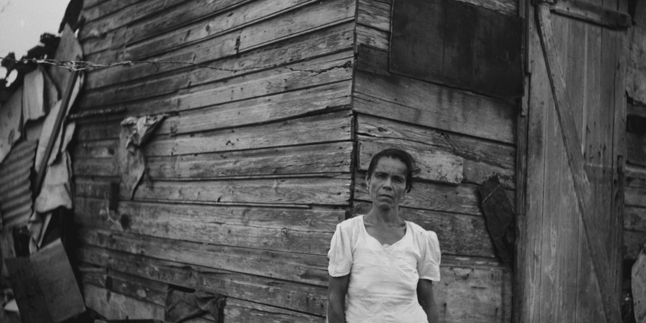 Woman in front of her house in Santurce, San Juan, Puerto Rico