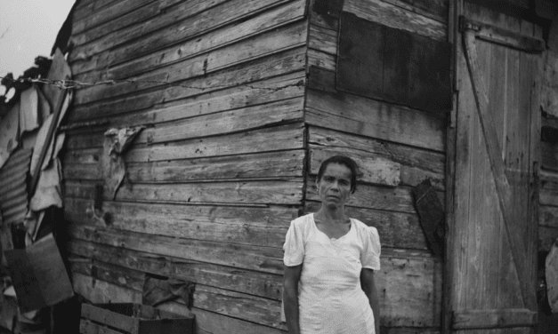 Woman in front of her house in Santurce, San Juan, Puerto Rico