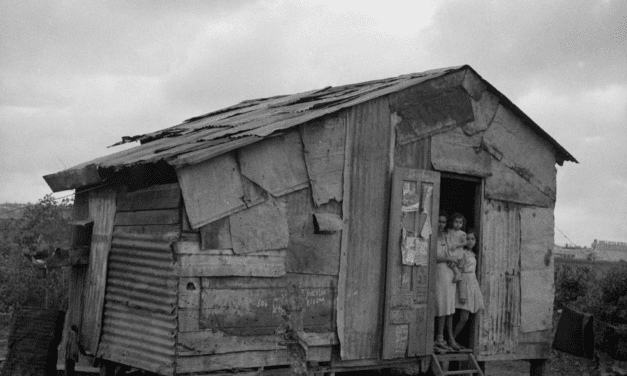 A family in the doorway of their home in Santurce, Puerto Rico