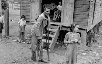 A disabled man walks around the huge slum known as “El Fangitto”