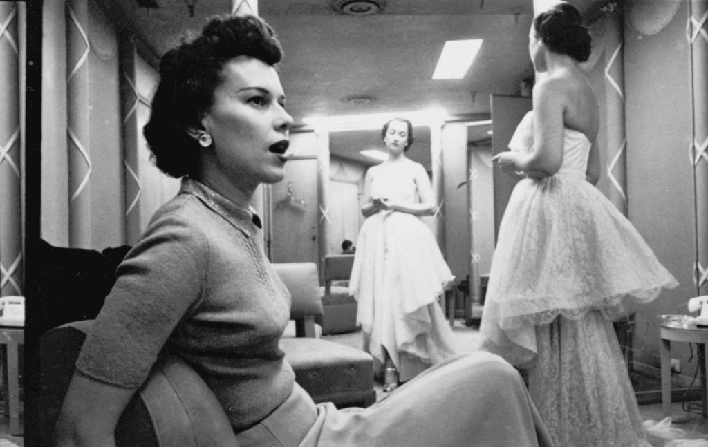 A photograph by Stanley Kubrick showing women trying on dresses in Chicago