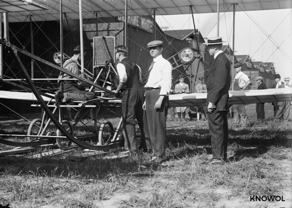 Men looking at an airplane in Garden City, NY in 1911 