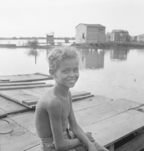 A boy sitting in the San Juan Slum of El Fangitto in 1941