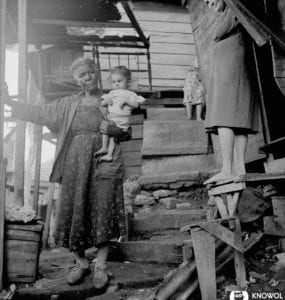 Woman holding a child in La Perla, a slum area of San Juan Puerto Rico in 1941