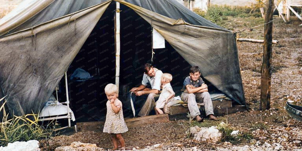 Migrant laborer’s family near Canal Point Packinghouse, Florida