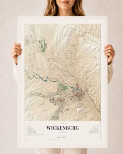 A framed 24 by 36 inch KNOWOL map print of Wickenburg, Arizona, held up in both hands